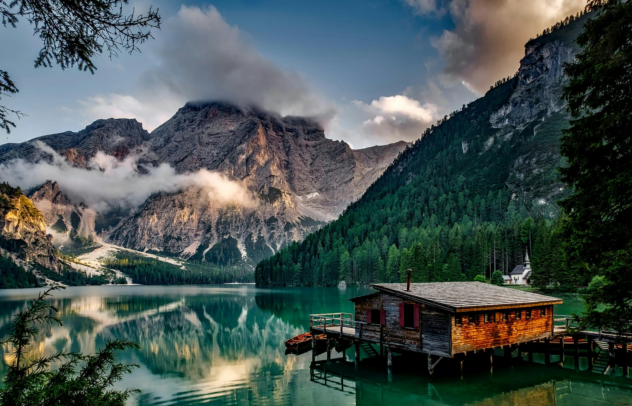 home page, lake in the mountains with dock in the foreground